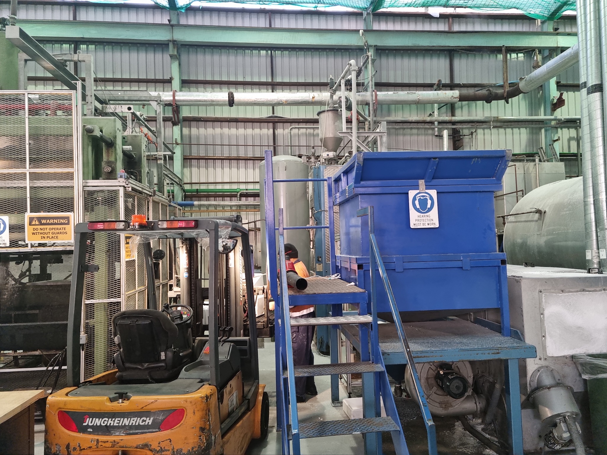 Production machinery and forklift operating inside the Wiri warehouse